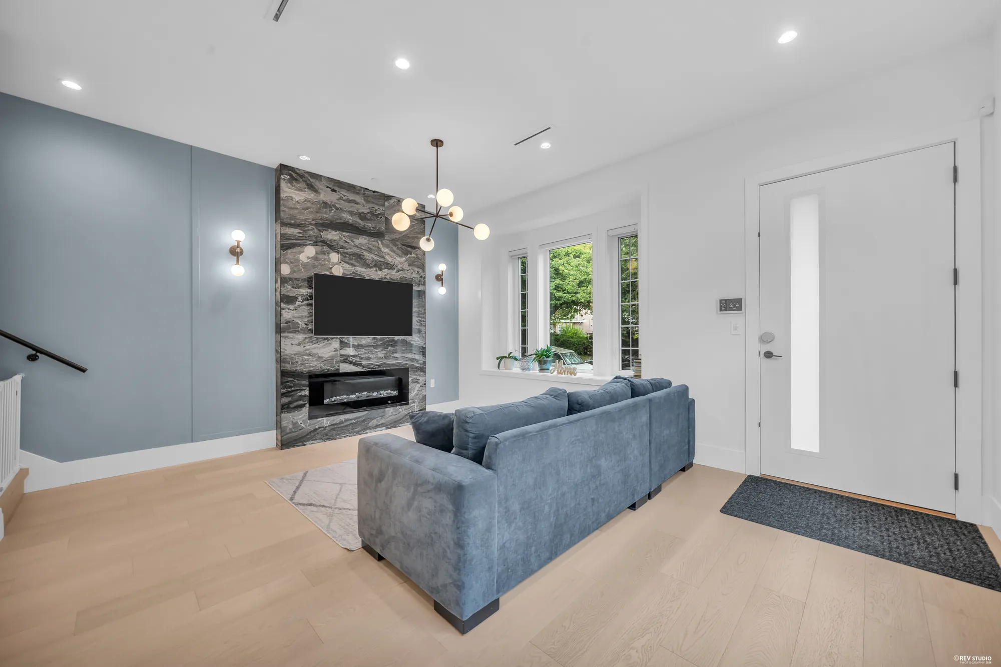 The fireplace wall and the front door, the sectional facing them